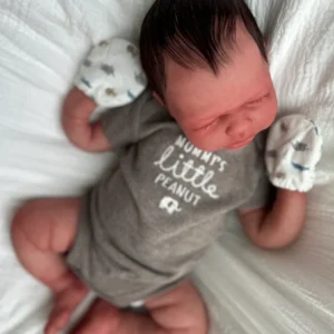 Handcrafted European lifelike silicone newborn doll with realistic skin, weighted body, and soft, cuddly features.