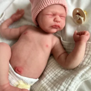 Soft silicone lifelike newborn doll in Europe with realistic sleeping pose and skin-like texture for emotional support.