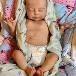 Realistic newborn doll in Europe dressed in newborn baby clothes, showing lifelike size and posture.